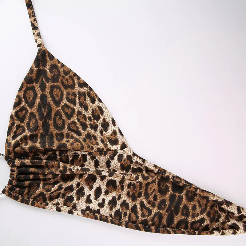 Leopard print bikini top on a white background