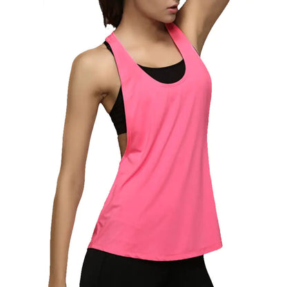 Pink tank top with black accents worn by a model on a white background