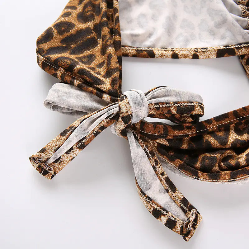 Leopard print headband with a bow on a white background