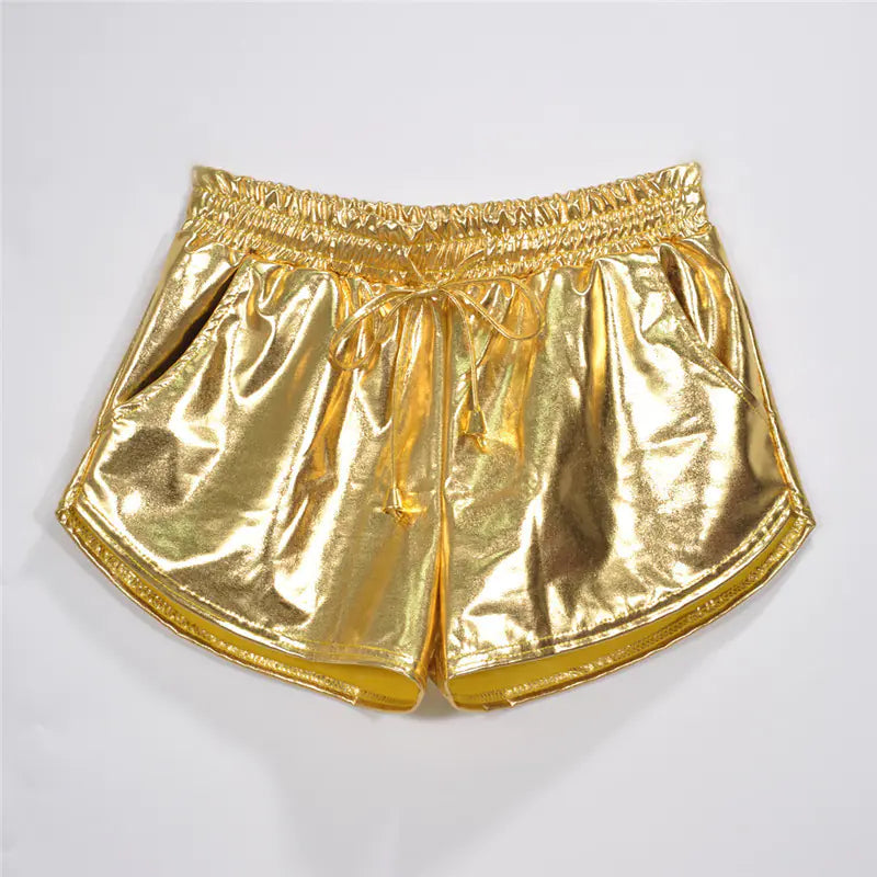 Gold metallic shorts on a light gray background