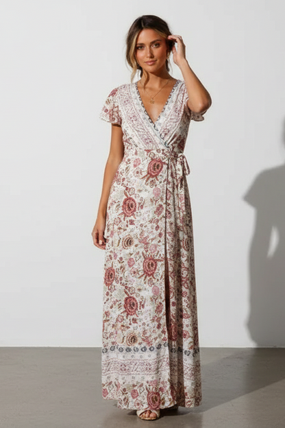 Woman wearing a floral dress against a white background