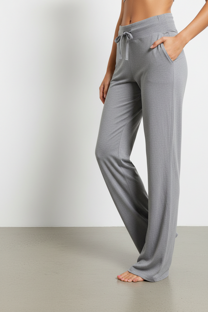Gray wide-leg pants worn by a person on a plain background