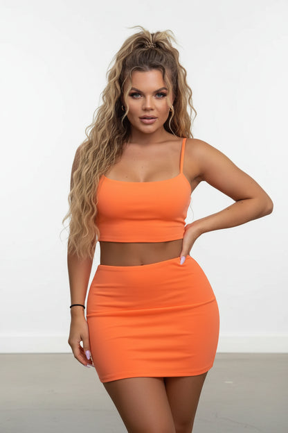 Woman wearing an orange two-piece outfit