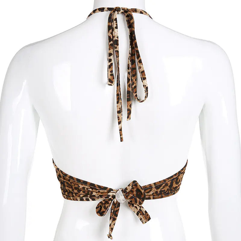 Leopard print halter top on a mannequin with a white background