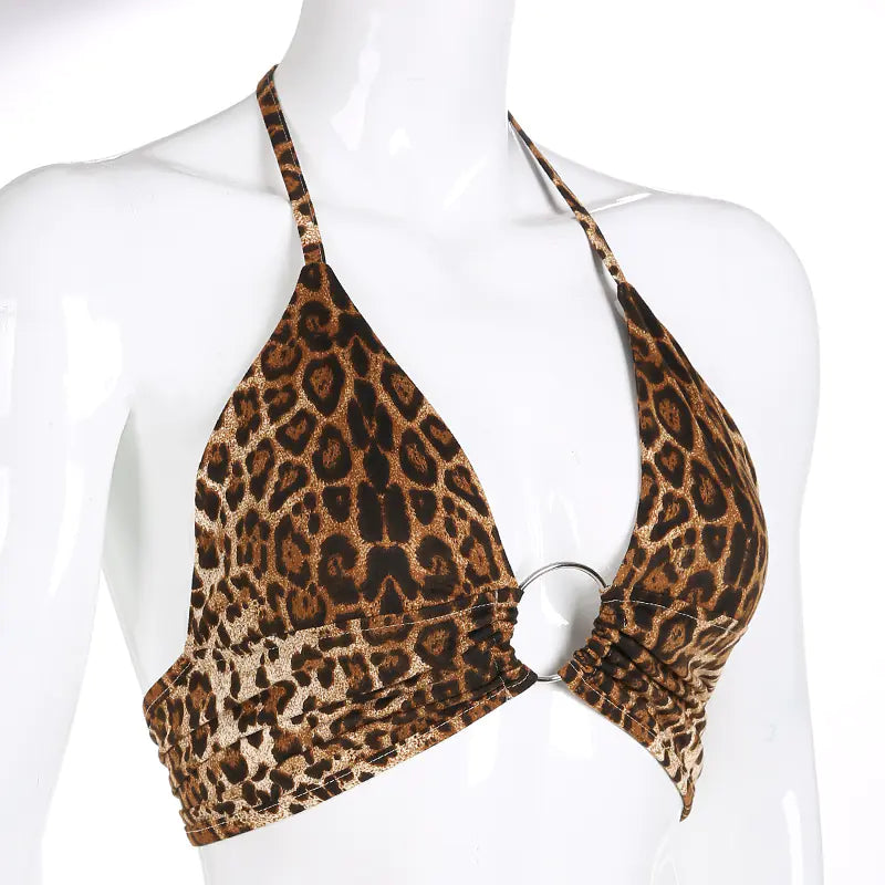 Leopard print halter top on a mannequin against a white background