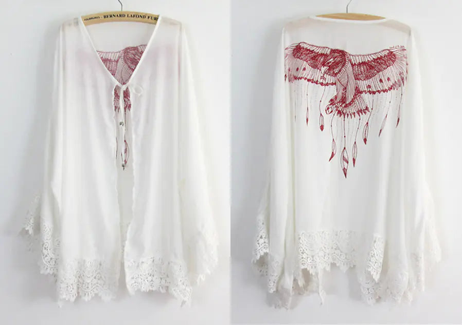 White lace top with red floral design on a white background