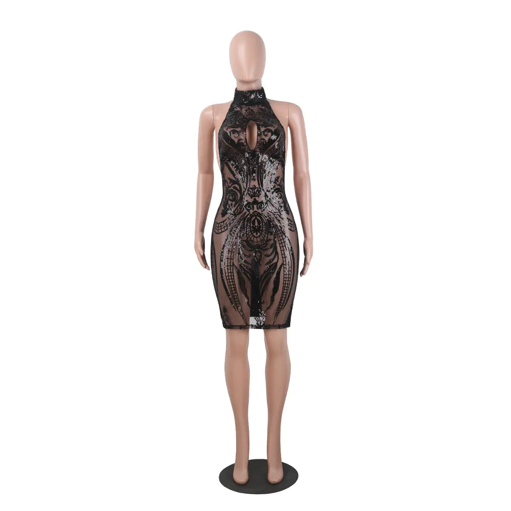 Black sequin dress on a mannequin against a white background