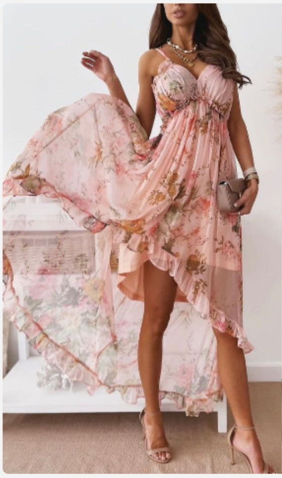 Woman wearing a pink floral light chiffon dress