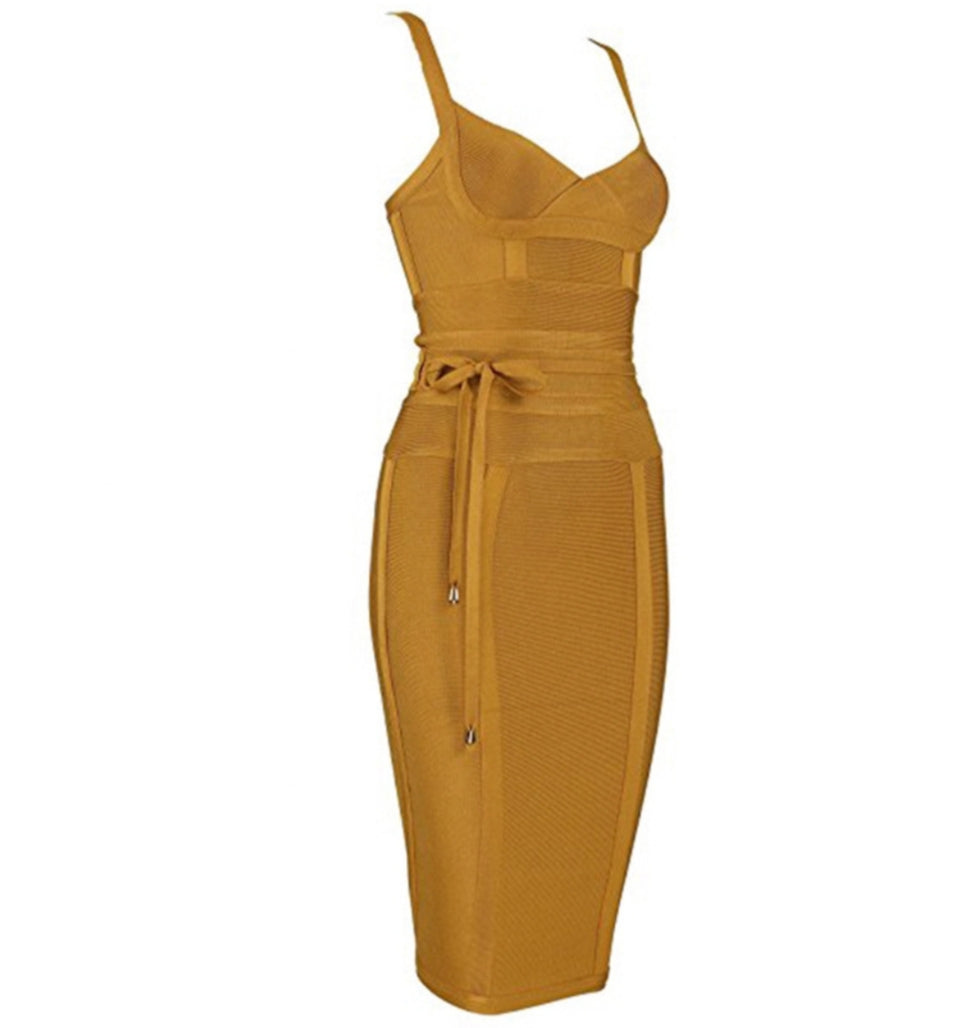 Mustard yellow dress with thin straps on a white background