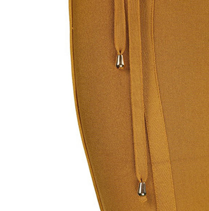 Close-up of a mustard yellow garment with a drawstring on a white background