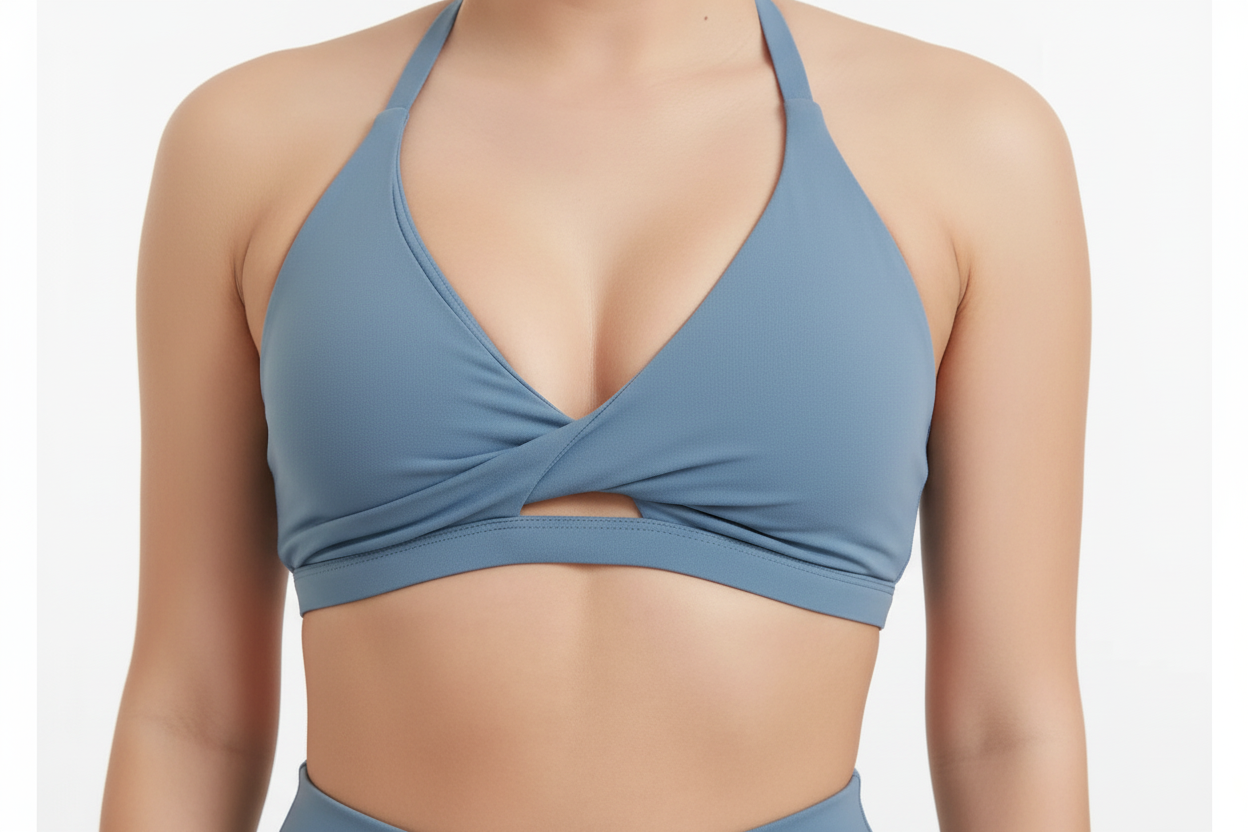 Blue sport top worn by a person on a white background