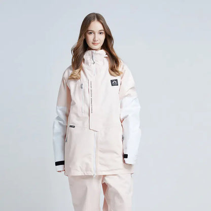 Person wearing a light pink snowsuit on a white background